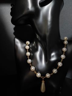 Beautiful long 1950s style necklace, made with large white Majorca pearls /12 mm/. The necklace is with a drop pendant. The necklace is very elegant, perfect for low-cut evening dresses but also for a single-colored winter sweater. The necklace is 81cm long and has an adjustable clasp with a 6cm extension. Perfect for those who love elegant style. All jewels are delivered in a decorated box, ready to be given as a gift to your loved one. How to take care of your jewellery: put on your beauty products (cosmetics, perfumes, ...) before wearing your precious jewel. Clean your jewelry with a soft cloth after wearing. Don't use water. Make sure you store your jewelry separately to avoid scratching it. Store away from heat sources, in a dry place in the special box. SHIPPING CONDITIONS I ship to Vintage Pearl White Necklace With Pearl Pendant, Vintage Dangle Pearl Drop Necklace, Vintage Pearl Drop Dangle Necklace, Vintage Pearl White Necklace With Pearl Charm, Vintage Pearl Drop Necklace For Party, Vintage Pearl White Necklaces With Pearl Charm, Pearl Dangle Necklace With Charm For Party, Dangle Pearl Charm Necklace For Party, Vintage White Necklace With Pearl Pendant