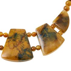 Jay King Sterling Silver Golden Quartzite 18" Necklace Go for the bold, beautiful look of natural gemstones when you accessorize with this handcrafted Golden Quartzite necklace. The unique stone features varying shades of golden yellow and green with an intriguing, dark matrix.       Necklace approx. 18"L x 5/16"W with 2-3/4" extender     Drop approx. 1-11/16"L x 1-1/2"W     Stamped .925     Hook closure     Necklace drape has five geometric-shaped stations of multicolor "golden quartzite" strung together and connected via two strands of round, quartzite beads     Single strand of round, multicolor quartzite beads complete necklace   Stone Information       All sizes and weights approximate     Stabilized Golden Quartzite - Freeform (21x26mm to 38x42mm), round (6-8mm); mined in China     T Artisan Yellow Gemstone Bead Necklaces, Artisan Yellow Gemstone Beaded Necklaces, Artisan Yellow Gemstone Beads Necklace, Yellow Agate Jewelry With Natural Stones, Gold Jasper Necklace With Natural Stones, Yellow Agate Gemstone Jewelry, Unique Yellow Gemstone Necklaces, Unique Yellow Gemstone Necklace, Necklace Stone