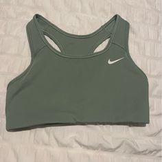 Brand New Nike Sports Bra Never Worn Before. I Took The Tags Off Before Trying It On And It Didn’t Fit Me. Very Pretty Green And Comfortable Unlined Interior. Bundle With Other Items In My Closet To Save!! Nike Solid Sports Bra For Sports, Fitted Nike Green Activewear, Fitted Green Nike Activewear, Nike Stretch Activewear For Sports Season, Nike Solid Color Sports Bra, Nike Fitted Activewear With Built-in Padding, Green Sportswear Tops With Light Support, Sporty Green Top With Light Support, Green Casual Sports Bra