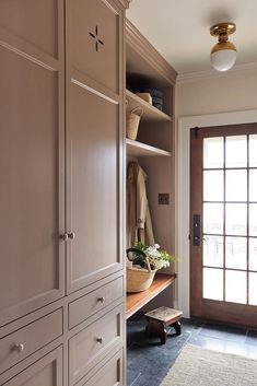 a large closet with lots of drawers and doors