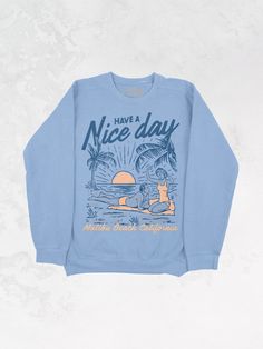 Get all of the summer-y vibes in this oversized Malibu Beach, California inspired sweatshirt!- Features the phrase "Have A Nice Day" across the top with a man and woman lying on a beach & "Malibu Beach, California" underneath it all in a navy and peach ink- Screen print transfer that is individually heat pressed onto each sweatshirt- Vintage washed sweatshirt that gets softer after every wash- Oversized fit- Sizing Translation: XS/S = M , S/M = L , L/XL = XL . 2XL/3XL = 2XL- 100% Cotton - Model is 5'9" wearing a size 2XL/3XL in the color Sage**due to screens & filters color may vary from pictures** Oversized Graphic Print Sweatshirt For Vacation, Oversized Spring Beach Sweatshirt, Oversized Graphic Print Sweatshirt For Beach Season, Beach Season Graphic Print Long Sleeve Sweatshirt, Vintage Graphic Print T-shirt For Beach Season, 90s Sports, Malibu Beaches, Western Chic, Vintage Sweatshirt