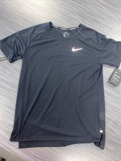 NIKE RUNNING T Shirt DRI-FIT NEW W/TAGS Reflective Women’s SMALL Black SWOOSH. Pit to pit measures 17 inches Length is 24 inches Athletic Fit Functional Tops For Streetwear, Functional Athletic Tops For Streetwear, Dri-fit Tops For Running During Sports Season, Casual Dri-fit Short Sleeve Activewear, Functional Running Tops With Graphic Print, Nike Breathable Tops For Sports Season, Casual Sports T-shirt With Go-dry, Athletic Fit Tops With Logo Print, Casual Go-dry T-shirt For Sports