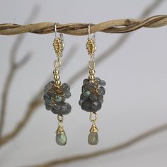 These raspberry earrings are glamorous and sweet! Made of gold filled with a silver hook, these bohemian inspired earrings have such unique details that make them unlike anything else! They feature gold filled wire wrapping, gold filled beads, and a cluster and drop of labradorite gemstones. They look gorgeous matched with casual jeans and a tee or a summery dress. Also they make for lovely bridesmaid earrings. Materials: Stone: labradorite Metal: gold filled, silver Measurements: Total length ( Hand Wrapped Brass Dangle Earrings, Gold Hand Wrapped Dangle Earrings, Handmade Gold Dangle Cluster Earrings, Raspberry Earrings, Waterfall Ideas, Gemstone Meanings, Labradorite Bracelet, Cluster Earrings, Romantic Gift