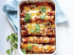 a casserole dish with meat, cheese and cilantro garnish