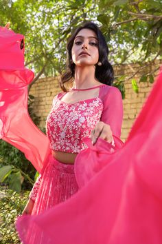 Crafted from high-quality georgette and net fabric, the Pink Layered Lehenga creates a gorgeous, flowy look that will make you feel like royalty. The layered design adds depth and dimension to the lehenga, creating a dramatic and ethereal effect.
The matching hand-embroidered blouse is the perfect complement to the lehenga, featuring intricate embroidery work that adds an extra layer of sophistication and glamour. The blouse perfectly balances the dramatic design of the lehenga, creating a look Traditional Drape Gown With Georgette Material, Traditional Drape Gown With Unstitched Blouse In Georgette, Designer Cutdana Georgette Gown, Net Anarkali Lehenga, Navratri Sharara With Sheer Dupatta In Georgette, Elegant Net Sets For Navratri, Fitted Net Sharara With Cutdana, Diwali Net Sets With Cutdana, Georgette Sharara With Sheer Dupatta For Diwali