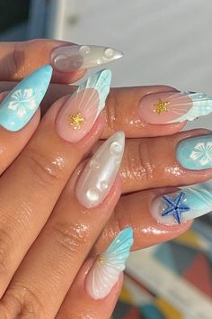 Let your inner Ariel burst free with these absolutely stunning ocean nail ideas. These are cute mermaid nails that bring the beauty of the ocean to your fingertips. Beach nails you won't be ab;r to get over! Ongles Baby Blue, Beach Themed Nails, Vacation Nails Beach, Mermaid Nail Art, Seashell Nails, Beachy Nails, Summer Nails Beach, Baby Blue Nails, Nagellack Trends