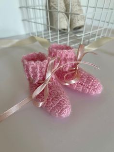 Cute hand-knitted baby booties for newborns, soft, made with 100% acrylic baby yarn. They are knitted in one piece and are a stretchy and comfortable fit.  They are excellent new-born photo prop or a gift for a mom-to-be. Or just a cute warming gift Some of them have satin ribbon or brown suede cord (2.6mm) that helps to hold them securely. They are available in the following colours and dimensions: (1) WHITE: the feet is about 9 cm length, the height of the bootie is about 7 cm. (2) WHITE: the feet is about 7,5 cm length, the height of the bootie is about 6 cm. (3) BROWN: the feet is about 8-8,5 cm length, the height of the bootie is about 6 cm. (4) YELLOW: the feet is about 8-8,5 cm length, the height of the bootie is about 7 cm. (5) LIGHT PINK: the feet is about 8,5 cm length, the heigh Pink Booties With Round Toe As Gift, Pink Round Toe Booties As Gift, Cute Pink Booties As Gift, Pink Booties With Soft Sole For Gift, Pink Booties With Soft Sole As Gift, Cute Yarn Booties As A Gift, Cute Pink Booties For Gift, Yarn Booties With Round Toe As Gift, Cute Yarn Booties As Gift