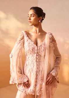 Radiate charm in this rose ombre organza garara set featuring a peplum top and bustier. This ensemble is adorned with exquisite 3d floral embroidery, enhanced by crystals, sequins, and pearls. Complete with a stylishly designed dupatta, this outfit is a testament to elegance and sophistication. Pakistani Outfits, Dusty Rose, Floral Embroidery, Peplum Top, Indian Fashion, Occasion Wear, Passion For Fashion, Unique Designs, Celebrities