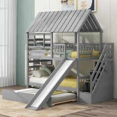 a gray bunk bed with a slide next to it