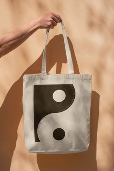 "This 100% cotton bag comes in one size - 15\" x 16\"- perfect for everyday wear. While the canvas material will show off the design in great colors, it's durable and will last for years.  The bag features 20\" handles (made from the same canvas), making it easy to carry even with a week's worth of shopping. 100% cotton canvas. Heavy fabric (12 oz/yd² (406.9 g/m Single-sided" Eco-friendly Canvas Bags For Daily Use, Large Eco-friendly Canvas Shoulder Bag, Large White Cotton Shoulder Bag, White Cotton Bags For Daily Life, Eco-friendly Canvas Bag With Graphic Print, Eco-friendly Graphic Print Canvas Bag, Cotton Rectangular Shoulder Bag For Daily Use, Travel Cotton Shoulder Bag With Graphic Print, Cotton Tote Bag For Daily Life