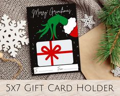 a christmas card with an image of a green creature on it and the words, 5x7 gift card holder