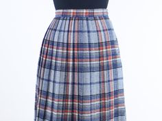 Item Description This is a gorgeous vintage wool blend accordion pleated skirt! I love the high rise, the midi length, and the earthy color tones. The pattern and color-way of the plaid is pretty and can be eye catching, while also being very versatile and subtle for more casual outfits as well. The skirt has side zip and button entry. The skirt is not lined, so if you are sensitive to wool fabrics you may want to wear this with a slip or style it with tights. This skirt is in great vintage cond Scottish Style Fitted Pleated Skirt For Fall, Fall Scottish Pleated Skirt, Vintage Pleated Fall Skirt For Workwear, Vintage Pleated Skirt For Workwear In Fall, Vintage Accordion Pleats Skirt For Fall, Retro Accordion Pleated Skirt For Fall, Vintage Plaid Pleated Skirt For Fall, Vintage Full Pleated Skirt For Fall, Pleated Skirt Blue