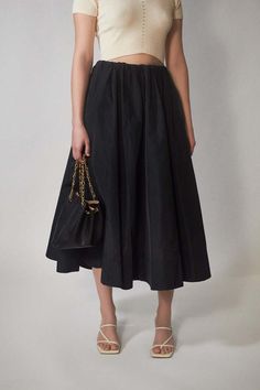 Cut from our luxurious and crisp silk taffeta francina is a high-waisted midi skirt with a voluminous a-line silhouette. beautifully crafted it is framed by a concealed elastic waistband and ends above the ankle.    - 69% polyester 31% silk  - voluminous a-line silhouette  - made in portugal    fits true to size Voluminous A-line Skirt For Evening, Cocktail A-line Skirt With Pleated Waist, Black A-line Voluminous Skirt, Evening Skirt With Pleated Waist Midi Length, Evening Midi Skirt With Pleated Waist, A-line Gathered Skirt For Evening, Black Silk Voluminous Skirt, Chic Black Silk Skirt, Evening Full Skirt Bottoms With Elastic Waistband