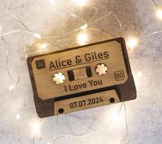 an audio tape shaped ornament with the words i love you written on it