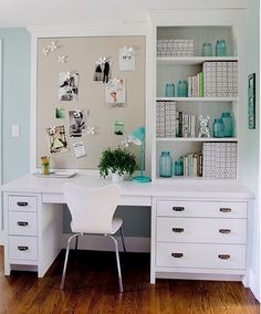 a white desk with drawers and a chair in front of it on top of a hard wood floor