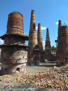 the ruins of an old factory are shown against a blue sky