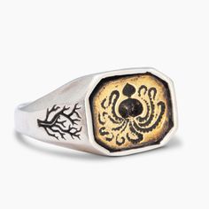 a signet ring with an octopus on it