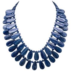 One-of-a-Kind Kyanite is a gemstone that is prized for its rich and vibrant blue color, which is even stronger and more vibrant than traditional Sapphire. When faceted, Kyanite can often be sold as Sapphire, but it is the natural, highly polished, opaque gemstone that truly shines. This necklace features two strands of perfectly matched teardrop-shaped Kyanite beads, separated by polished Kyanite beads for added texture and interest. The matching Kyanite and Sterling Silver clasp add a touch of Kyanite Jewelry, Artisan Bracelets, Silver Bead Necklace, Cultured Pearl Necklace, Baroque Pearl Necklace, Tourmaline Necklace, Blue Kyanite, True Blue, Stunning Necklace