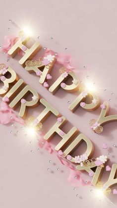 the words happy birthday are spelled in gold and pink