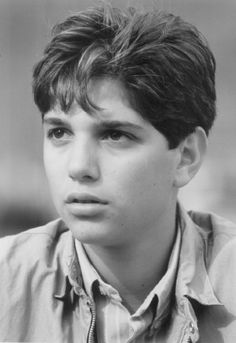 black and white photo of young man with short hair