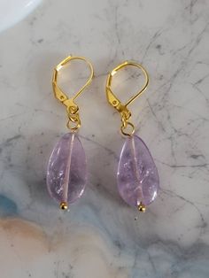 Amethyst earrings,dainty and fun for work or a night out. Hanging on a gold tone latch ear wire. All earrings are handmade to be as close as possible but every stone is unique and individual. Made to be loved and enjoyed. Dangle Earrings Gold, Earrings Dainty, To Be Loved, Amethyst Earrings, Gold Earrings Dangle, Ear Wire, Earrings Gold, Gold Earrings, Dangle Drop Earrings