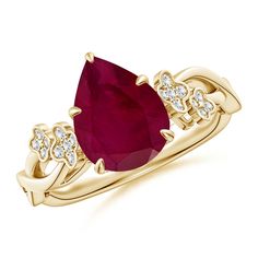 a gold ring with an oval ruby stone and diamonds on the sides, set in 18k yellow gold