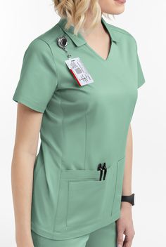 UA BUTTERSOFT STRETCH WOMEN’S SHORT SLEEVE SCRUB TOP WITH COLLAR & KNIT PANELS. UA Butter-Soft STRETCH Women's 3-Pocket V-Neck Knit Panel Scrub Top Nursing Scrubs - Size 2X Water Mint Cotton/ Polyester/ Spandex Scrub Suit Design, Nurse Fashion Scrubs, Nursing Scrubs Pattern, Nurse Outfit Scrubs, Unique Scrubs, Scrubs Pattern, Yoga Scrub Pants