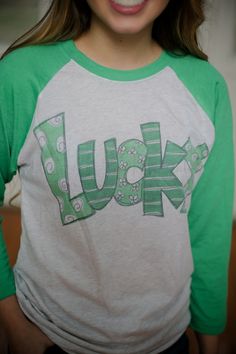 Lucky Raglan - Tees Fun Long Sleeve T-shirt With Screen Print, Cute Green T-shirt With Custom Print, Trendy Crew Neck Sublimation T-shirt With Screen Print, Cute Unisex Long Sleeve T-shirt, Cute Green Tops With Name Print, Fun Green Tops With Letter Print, Funny Green Tops With Letter Print, Funny Green Top With Letter Print, Green Graphic Tee With Text Print