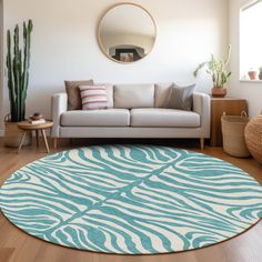 a living room with a couch, mirror and rug in the middle on the floor