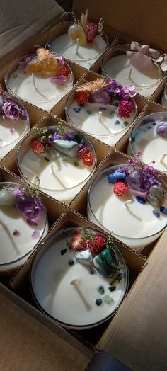 several empty plates with flowers on them in a box