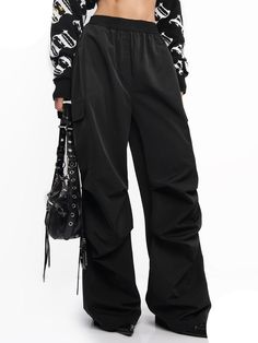 These cargo pants provide a loose fit that's perfect for street wear fashionistas. Featuring an elastic waist, they offer maximum comfort and a stylish look. Made of breathable fabric, they're great for all-day wear. Casual Wide Leg Cargo Pants For Streetwear, Techwear Ankle-length Cargo Pants, Black Baggy Wide-leg Cargo Jeans, Trendy Winter Wide Leg Pants With Pockets, Wide Leg Relaxed Fit Cargo Sweatpants, Wide Leg Pants For Winter Streetwear, Casual Wide Leg Pants With Cargo Pockets For Streetwear, Baggy Urban Parachute Pants For Winter, Streetwear Wide-leg Pants With Hip Pockets