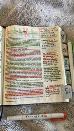 an open bible with crayons and markers