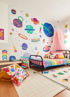 a child's bedroom decorated in bright colors