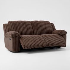 a brown corded couch sitting on top of a white floor