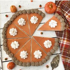 a pie is decorated with flowers and pumpkins