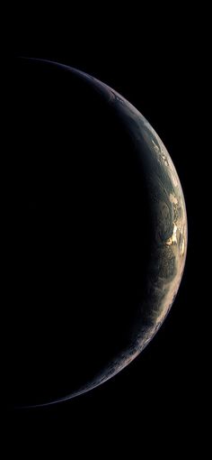 an image of the earth taken from space in this time lapse photo, it appears to be half mooned