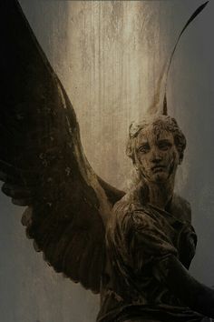 an angel statue with its wings spread out in front of a wallpapered background