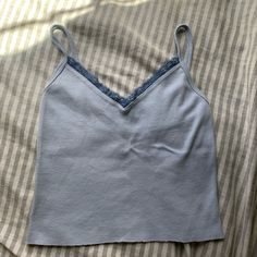 Brandy Melville Blue Lacey Tank Top!! Never Worn, New Without Tags!! No Stains, Rips, Or Pilling!! Send Me Offers Or Message Me To Negotiate!! Blue Cami Top For Spring, Blue Camisole Top For Spring, Blue Casual Tops With Lace Trim, Light Blue Cotton Casual Camisole, Casual Blue Tops With Lace Trim, Light Blue Casual Cotton Camisole, Blue Spring Camisole Top, Blue Stretch Camisole Top, Light Blue Stretch Camisole Top