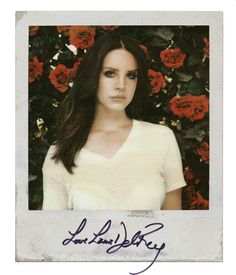 an autographed photograph of a woman in front of roses