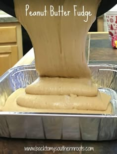 the peanut butter fudge is being made in a pan