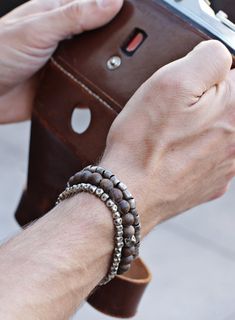 We Are All Smith handmade small geometric silver beads adjustable bracelet for Men. Knot clasp. Sizing: Bracelet is adjustable (one size fits all) Closure: Sliding knot. Materials: Small geometric silver beads. Cord: Faux Black Leather. Handmade in the USA. Silver Bracelet With Sliding Knot And Round Beads, Casual Silver Hand Wrapped Beaded Bracelets, Everyday Metal Beaded Bracelets With Round Beads, Metal Beaded Bracelets With Round Beads, Adjustable Metal Beaded Bracelets For Everyday Wear, Modern Adjustable Silver Wrap Bracelet, Masculine Everyday Adjustable Bracelets, Modern Silver Beaded Bracelets, Handmade Adjustable Stainless Steel Bracelets