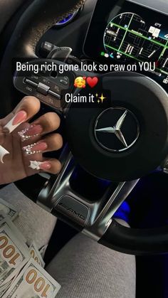 a woman driving a car with her hand on the steering wheel and text reading being rich gone look so raw on you claim it