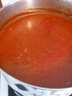 a pot on the stove filled with soup