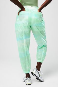 Sheer Ripstop Parachute Pant Fabletics green female Activewear >> Womens >> Bottoms >> Pants & Joggers >> Lounge Pants plus Everyday External Pockets Green Stretch Sweatpants With Elastic Waistband, Green Nylon Parachute Pants Athleisure, Green Nylon Parachute Pants For Athleisure, Green Nylon Parachute Pants With Relaxed Fit, Green Athleisure Parachute Pants With Pockets, Green Nylon Bottoms With Elastic Waistband, Green Tapered Leg Sweatpants With Elastic Waistband, Casual Green Nylon Pants, Green Nylon Sporty Parachute Pants