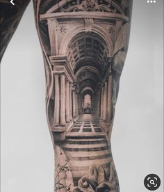 an image of a man's leg with tattoos on it and stairs in the background