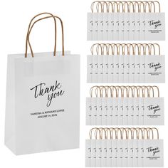 white paper bags with gold handles and thank you tags on the front, set of 10