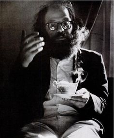 black and white photograph of a man holding a cup