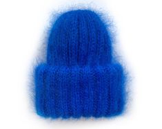 Chunky mohair beanie for women with double brim. This product is made especially for you as soon as you place an order. Please allow up to 3-7 business days production time before shipping. Colour name: BLUE. Made to order in 36 colors. Size: Stretch to fit ( 22-23 in / 56-58 cm) Composition: 50% mohair, 50% acrylic Recommended Care Instructions: Hand wash only. Dry flat. Made entirely by hand! Please note that real colors may slightly differ from their appearance on your display. Warm Mohair Beanie Hat, Hand Knitted Mohair Hats For Winter, Winter Beanie Mini Hats Made Of Yarn, Hand Knitted Mini Beanie Hats For Winter, Mohair Knitted Beanie Hat, Knitted Mohair Winter Hats, Winter Mohair Knitted Hat, Winter Knitted Mohair Hat, Blue Mini Hats For Winter