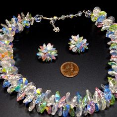 *Description: This is a gorgeous Vendome necklace in silver tone with Lucite flat Aurora Borealis beads in pastel colors with matching clip earrings from the 1960s. The flat crystal shaped beads are clear, pink, green with hints of blue on the AB coating. Vendome was the couture line of Coro. The tiny details add so much to the design. For example, the clear crystal baguette rhinestone on the hook clasp. There are also clear aurora borealis glass beads within the extension chain. The earrings ar Retro Multicolor Jewelry For Wedding, Multicolor Retro Jewelry For Wedding, Retro Multicolor Jewelry With Matching Earrings, Retro Multicolor Wedding Jewelry, Round Lucite Jewelry For Parties, Multicolor Glass Costume Jewelry Necklaces, Elegant Iridescent Necklace With Round Beads, Multicolor Clip-on Wedding Jewelry, Multicolor Clip-on Jewelry For Wedding