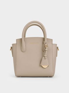 Taupe Harper Structured Top Handle Bag - CHARLES & KEITH US Beige Recyclable Shopping Bags, Modern Neutral Bag With Removable Pouch, Modern Rectangular Neutral Bag, Modern Neutral Rectangular Bag, Modern Taupe Rectangular Bags, Classic Neutral Bags With Adjustable Strap, Classic Neutral Bag With Adjustable Strap, Charles And Keith Bags, Trapeze Silhouette